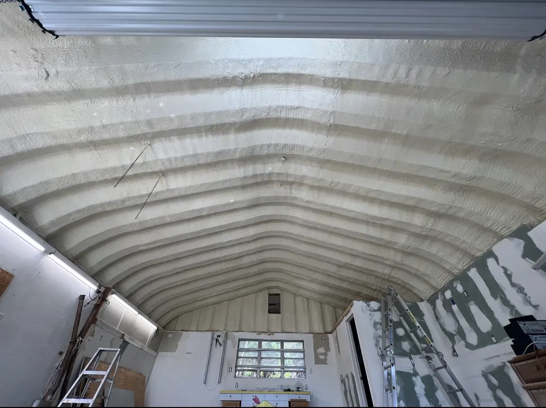 Spray polyurethane foam applied to the underside of a metal roof deck in Difficult Run